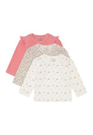 Three long-sleeve toddler shirts: one solid pink with ruffles, one white with small floral print, one white with cherry pattern.
