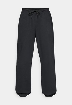 Black sweatpants with an elastic waistband, adjustable drawstring, and elastic cuffs at the ankles. Made of a soft, textured fabric.