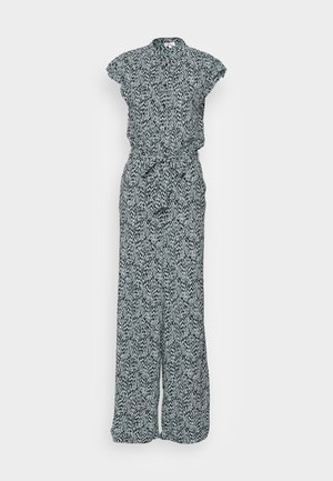 Combinaison florale en noir et blanc, à manches courtes et volantées, col boutonné, ceinture à nouer, et jambes larges amples avec une texture fluide.