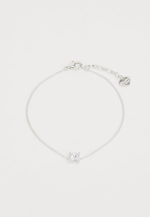 Silver chain bracelet features a cubic zirconia stone in a princess cut, with a lobster claw clasp and an adjustable length.