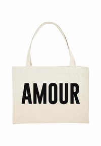 Stoffen tote bag in crème met het woord "AMOUR" prominent gedrukt in vette zwarte letters. Twee stevige handvatten voor het dragen.