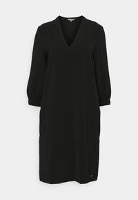 Vestito nero con scollatura a V, maniche a tre quarti a sbuffo e silhouette dritta. Realizzato in tessuto liscio con dettagli minimi.