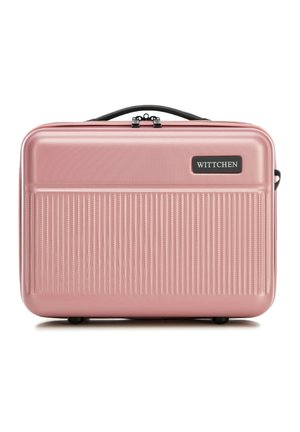 Hard-shell suitcase in light pink, featuring vertical ribbed pattern, a black handle, and zipper closure. Brand logo displayed on front.