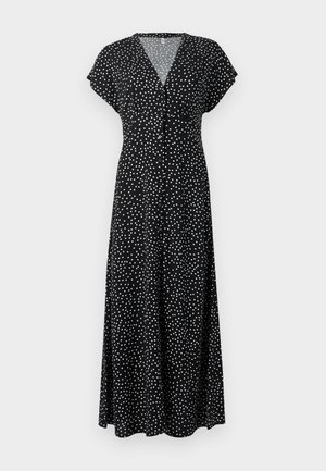 Abito lungo nero con pois bianchi, scollo a V, maniche corte a mantella e chiusura frontale con bottoni. Tessuto fluido e vestibilità comoda.