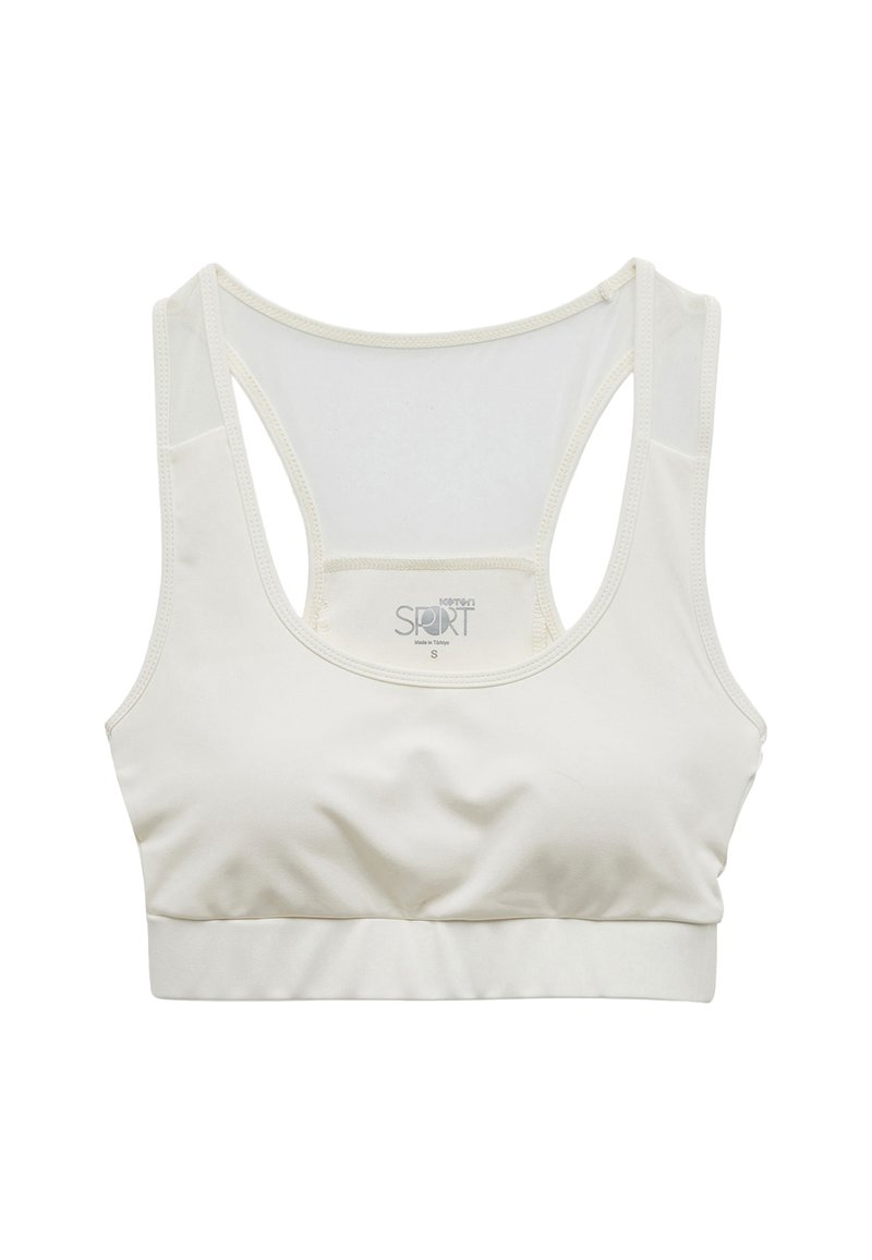 Lichtbeige sportbeha van gladde stof, met een racerback ontwerp, rekbare band en minimale stikseldetails voor comfort.