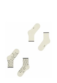 Beige Socken mit schwarzen Akzenten, zwei Paar mit einem Punktmuster und einem Paar mit einem einfarbigen Design, aus weichem Stoff gefertigt.
