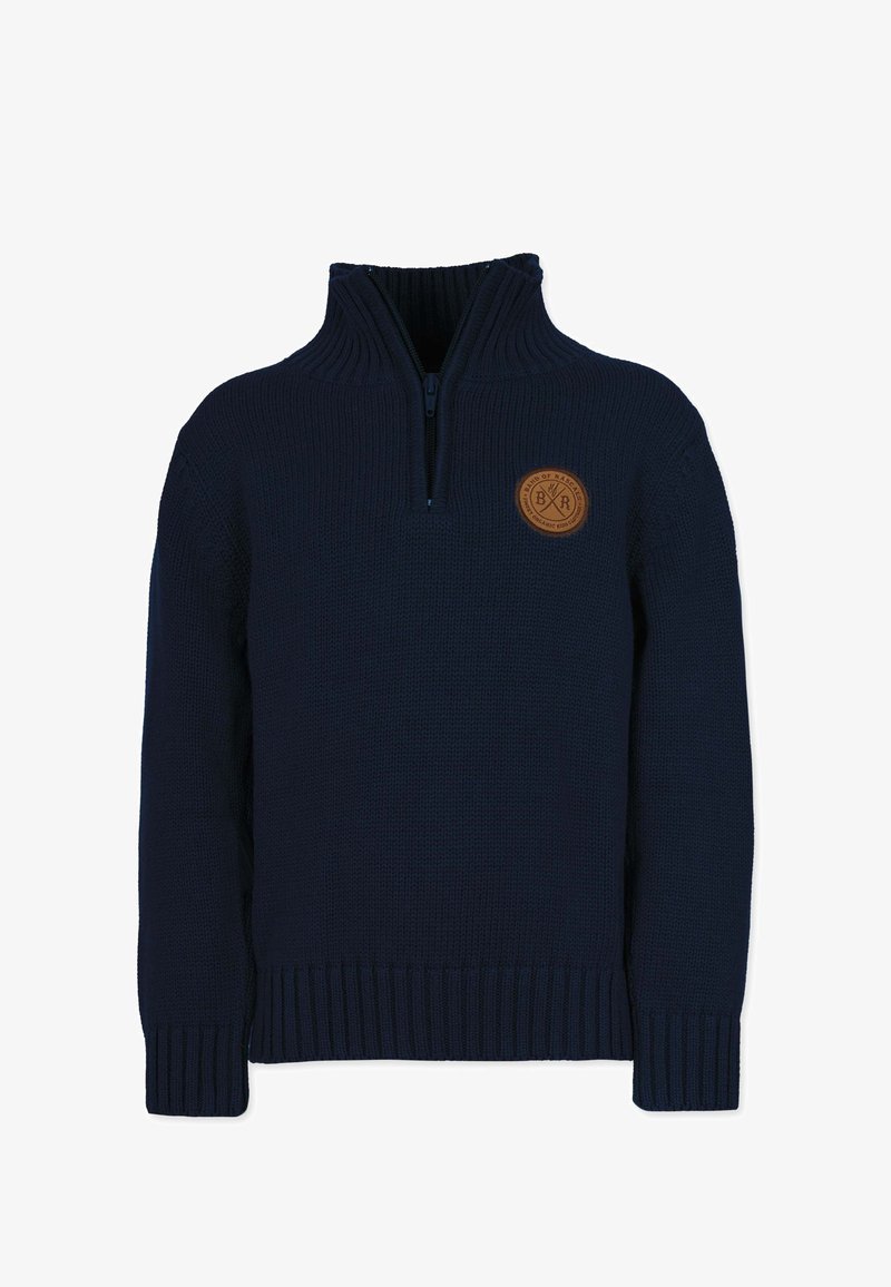 Sininen neulepusero, jossa on puolivetoketju kauluksessa, ribattu hihansuu ja helma. Puserossa on ympyräinen nahkapätkä, jossa on kohokuvioitu brändimerkintä rinnassa.