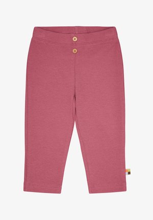 Hosen aus Waffelstrick in Pink mit einem gerippten Muster, ausgestattet mit zwei Holzknöpfen am Bund und einem kleinen, mehrfarbigen Etikett an der Seite.