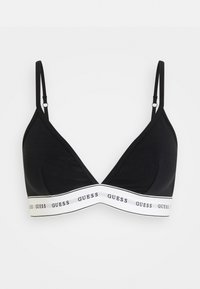 Black triangle bra with adjustable straps, featuring a white band with repeated "GUESS" text along the bottom. Soft, smooth fabric texture.