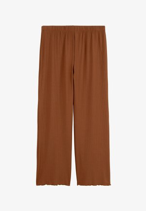 Pantalon large côtelé de couleur rouille avec taille élastique et détails subtilement ondulés à l'ourlet.