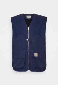 Námořnická modrá bezrukávová vesta z denimu, s zlatým zipem, dvěma velkými předními kapsami a nášivkou s logem Carhartt.