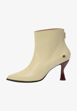 High heeled ankle boots - beige