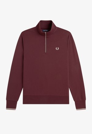 Jersey burdeos de manga larga con cremallera hasta un cuarto, puños acanalados con rayas blancas y pequeño logo de laurel blanco bordado en el pecho izquierdo.