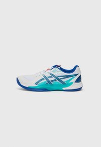 Sneaker featuring a white mesh upper, blue and teal accents, textured heel, and rubber outsole with significant grip patterns.