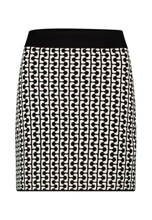 Schwarz-weißer Rock mit einem figurbetonten Design und elastischem Bund. Das Muster zeigt ineinandergreifende Formen. Glatte Textur.