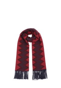 Red and dark blue zigzag patterned scarf with fringed edges, made from soft fabric. The design features contrasting bold patterns.