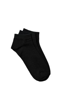 Calcetines de algodón negros hasta el tobillo con puños acanalados y cierre de dedo del pie sin costuras, que presentan una textura suave y un diseño minimalista.