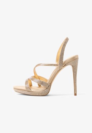 Sandalo con tacco alto beige con dettagli intricati di strass. Presenta cinturini incrociati e un tacco a spillo per un profilo elegante.