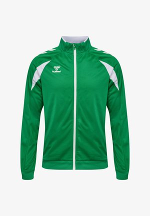 Zielona sportowa kurtka z białym zamkiem błyskawicznym, białymi akcentami na ramionach oraz logo hummel na lewej piersi.