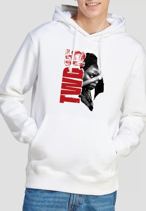 White hoodie with a red and black graphic of a serious person and the word "TWICE" in bold red letters vertically.