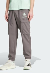 adidas Originals - MERCEDES - AMG PETRONAS FORMULA ONE TEAM PREMIUM WOVEN PANTS MEN - Tracksuit bottoms - grey strata   frozen green Thumbnail Image 1