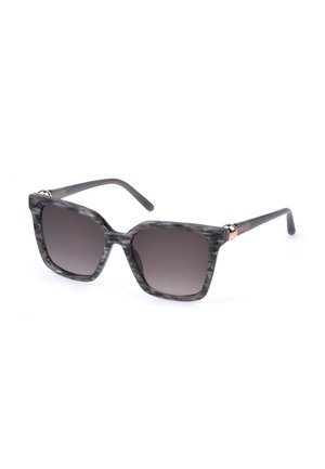 Lunettes de soleil carrées gris marbré avec des verres dégradés foncés et des branches fines noires affichant un petit logo doré près des charnières.