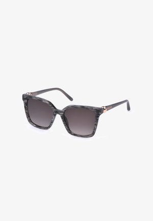 Lunettes de soleil carrées gris marbré avec des verres dégradés foncés et des branches fines noires affichant un petit logo doré près des charnières.