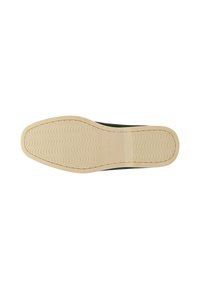 Grüner Sneaker mit einem strukturierten Textil-Obermaterial und einer beigen Gummisohle, die ein geprägtes Wellenmuster und seitliche Nahtdetails aufweist.