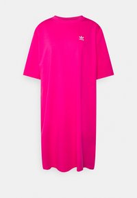 Överdimensionerad T-shirt i klarrosa, tillverkad av bomull. Har en rund halsringning och korta ärmar, med en vit Adidas-logotyp på bröstet.