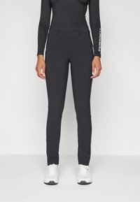 Kjus WOMEN WARM STRETCH TREGGINGS - Auduma bikses - black