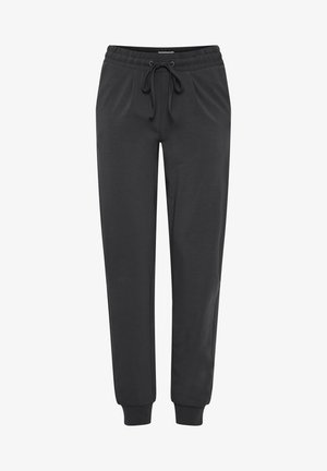 Mustad jooksupüksid elastse vöökoha, nööri ja kitsenevate säärematest. Valmistatud pehmest kangast, küljetaskute olemasolu.