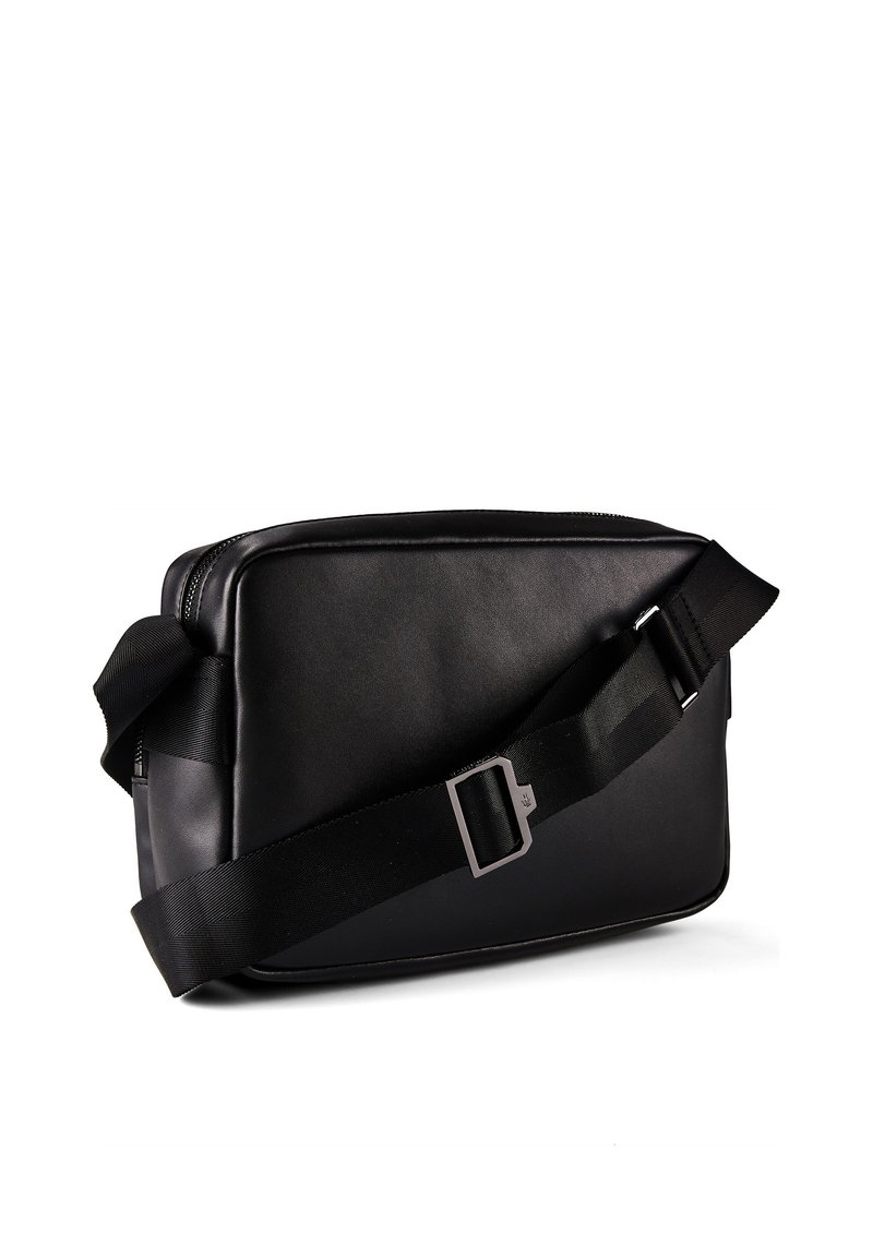 Black rectangular crossbody bag with adjustable wide strap and silver buckle on a white background.