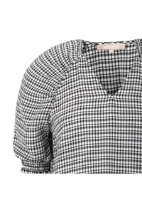 Blusa a cuadros en blanco y negro con escote en v, mangas abullonadas con fruncidos y detalle de puño elástico. Fabricada en tejido ligero.