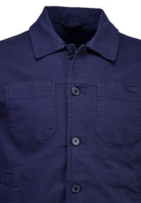 Navy work jacket made of sturdy fabric, featuring a collar, button closure, and two front pockets with flap detailing.