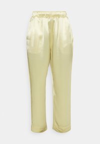 Ljust gula satintbyxor med elastisk midja, två sidofickor och tapered bendesign. Slät textur med en lätt glans.