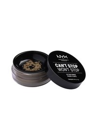 NYX Setting Powder i en genomskinlig plastbehållare med ett svart lock. Produkten är ljusbrun och har ett strukturerat puder på lockets yta.