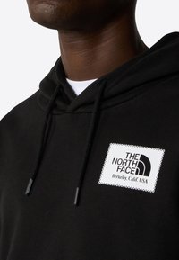 The North Face Jersey con capucha - black