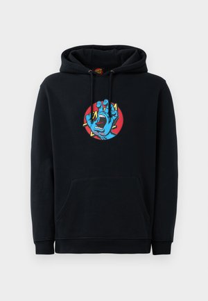 Zwarte hoodie met een grafisch ontwerp van een blauwe hand met een open mond tegen een rode cirkel. Bevat een voorzak en een trekkoord kap.