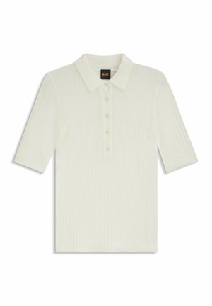 Short-sleeve polo in off-white ribbed fabric, featuring a button placket, collar, and straight hem. Smooth texture with subtle sheen.
