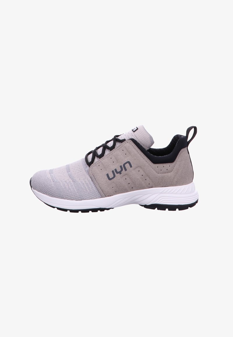 Light gray athletic shoe made of mesh and suede, featuring a black accent, a round toe, and a rubber sole with textured grip.