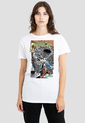 Woman wearing a white t-shirt with a vintage Amazing Spider-Man comic cover featuring Spider-Man fighting a large gray creature.
