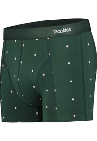 Zöld boxeralsó, puha anyagból, szétszórt fehér százszorszép mintával. Kényelmes gumírozott derékpánttal rendelkezik, amelyen a "Pockies" logó szerepel.