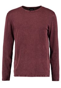 Sweatshirt bordeaux à manches longues en tissu doux. Présente un col rond, des coutures simples et une coupe décontractée. Aucun motif ou accent visible.