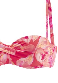 Ziedu raksta bikini topiņš rozā un korallu toņos, ar izgriezuma priekšpusi un regulējamiem siksniņām. Gluda, elastīga auduma.