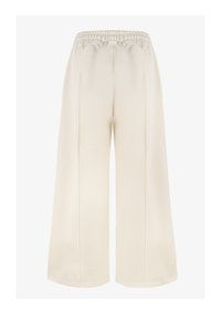 Creme kleurige broek met een brede pijpen en een elastische tailleband, met een gladde textuur en zij naden. Geschikt voor casual draag.