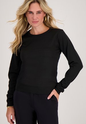 Zwarte lange mouw top met een ronde halslijn, gemaakt van een gladde stof, met een getailleerd ontwerp en geribde manchetten.