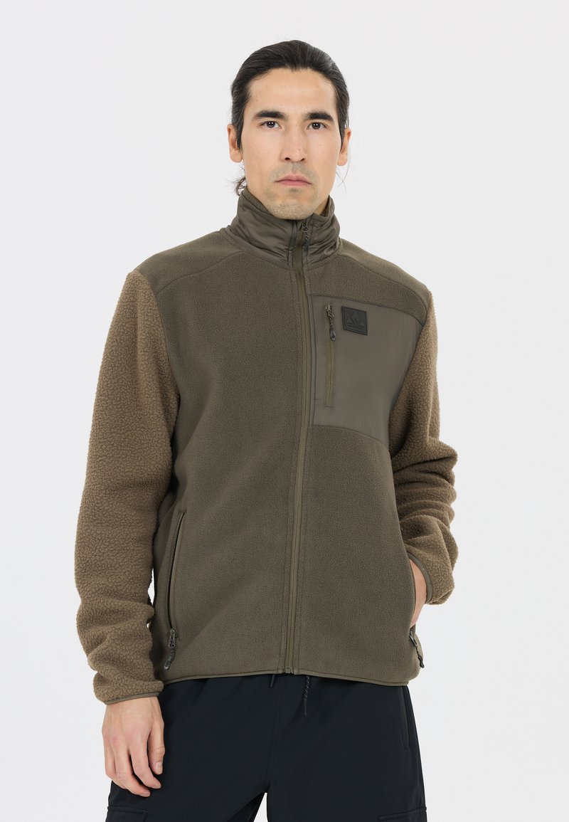 Fleece jacket in olive green with a smooth upper panel, contrasting textured sleeves, two side pockets, and a zippered chest pocket.