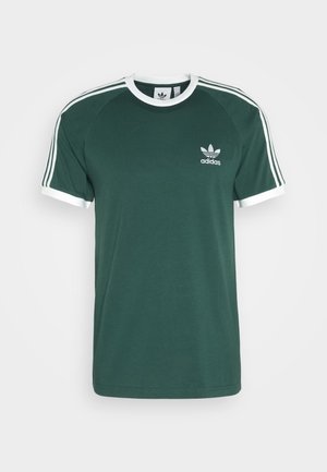 Green cotton t-shirt with white accents, featuring a crew neck, short sleeves, and three white stripes along the shoulders. Adidas logo on chest.