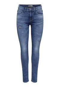 Jeans ajustados de denim azul con zonas desgastadas y detalles rasgados, que presentan un diseño estándar de cinco bolsillos y un cierre de botón.