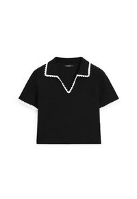 Haut noir à manches courtes avec un col en V et des détails de col et de poignets blancs festonnés, présentant un design en maille texturée.